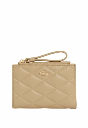 Beige quilted leather wristlet wallet with zipper closure and small gold crocodile logo on front.