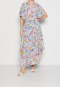 Maxikleid mit floralem Druck in vielen Farben, mit V-Ausschnitt, kurzen Ärmeln, Kordelzug in der Taille und asymmetrischem Saum.