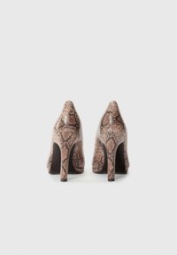 Python-print high-heeled shoes with a glossy finish, pointed toe, and a wide stiletto heel. Color includes shades of brown and beige.