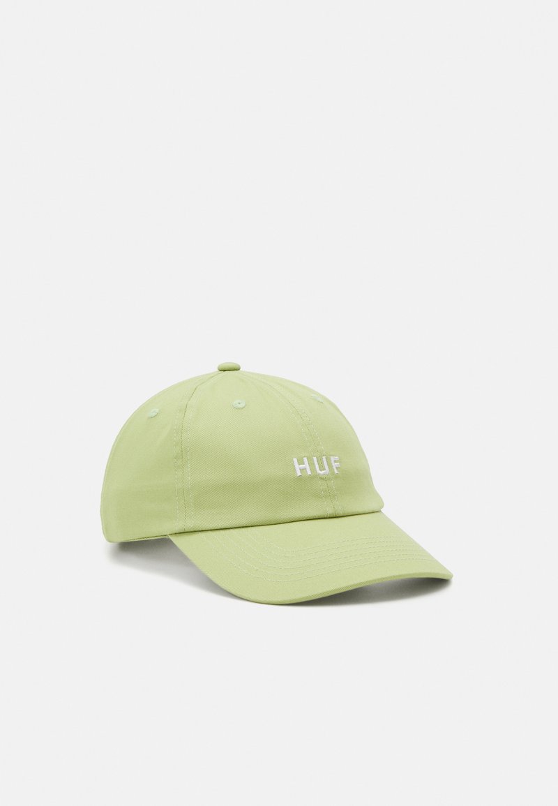Light green cotton cap with a curved brim, featuring white embroidered "HUF" logo on the front and tonal stitching details.
