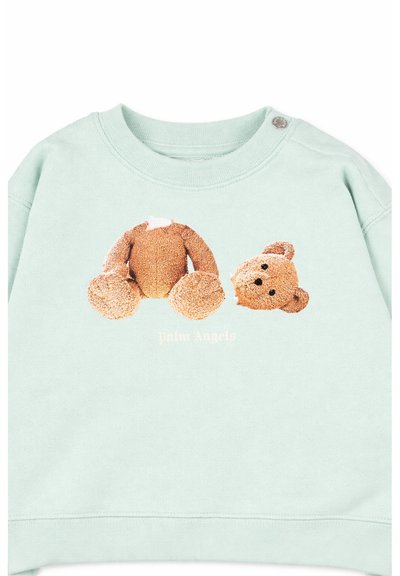 Sweat-shirt vert clair avec un motif représentant un corps d'ours en peluche sans tête à côté de sa tête détachée, avec le texte "Palm Angels" en dessous.