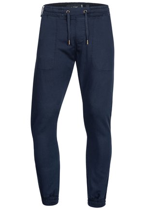 Marineblå joggingbukser med elastisk talje, snøre, to forlommer og elastiske manchetter.