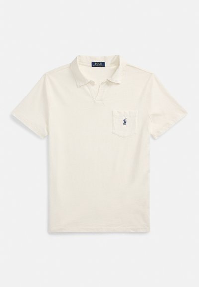 Short-sleeve polo shirt in cream cotton with a collar, front pocket, and navy embroidered logo on the left chest. Flat hem and side vents.