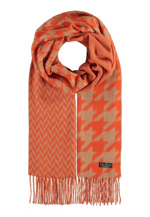 Orange og beige tørklæde med hundetands- og fiskebensmønstre, frynsede ender og et synligt sort mærkelabel.