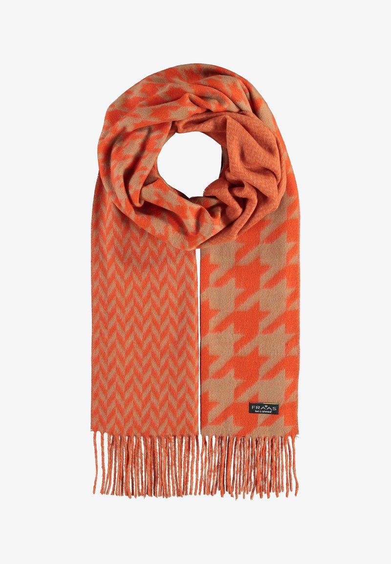 Écharpe orange et beige avec des motifs pied-de-poule et chevrons, extrémités à franges et étiquette de marque noire visible.