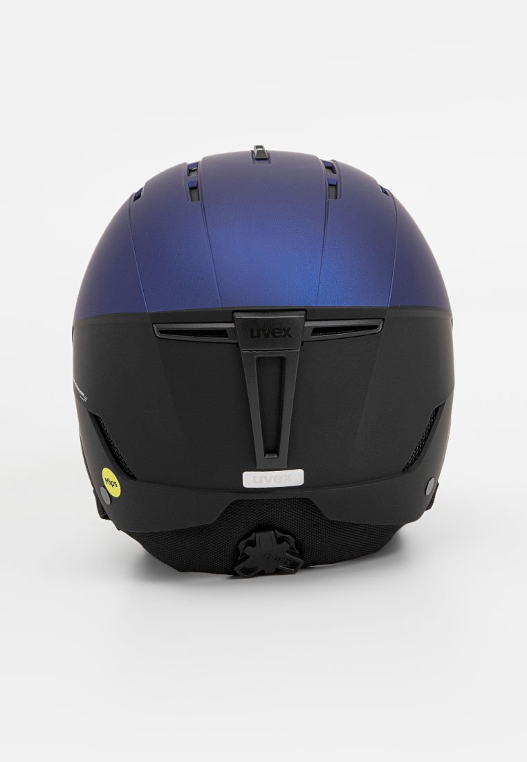 Casco de esquí con un acabado mate de color azul oscuro en la parte superior, sección inferior negra, aberturas de ventilación, dial trasero ajustable y detalles de marca.