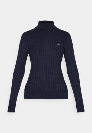 Marineblauer, gerippter Rollkragenpullover mit langen Ärmeln, strukturiertem Kabelstrickdesign und kleinem Logoakzent auf der Brust. Aus weichem Stoff gefertigt.