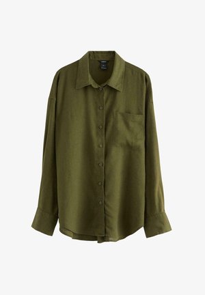 Olivengrøn skjorte med knapper, krave, lange ærmer og en brystlomme. Fremstillet af en glat, tekstureret stof.