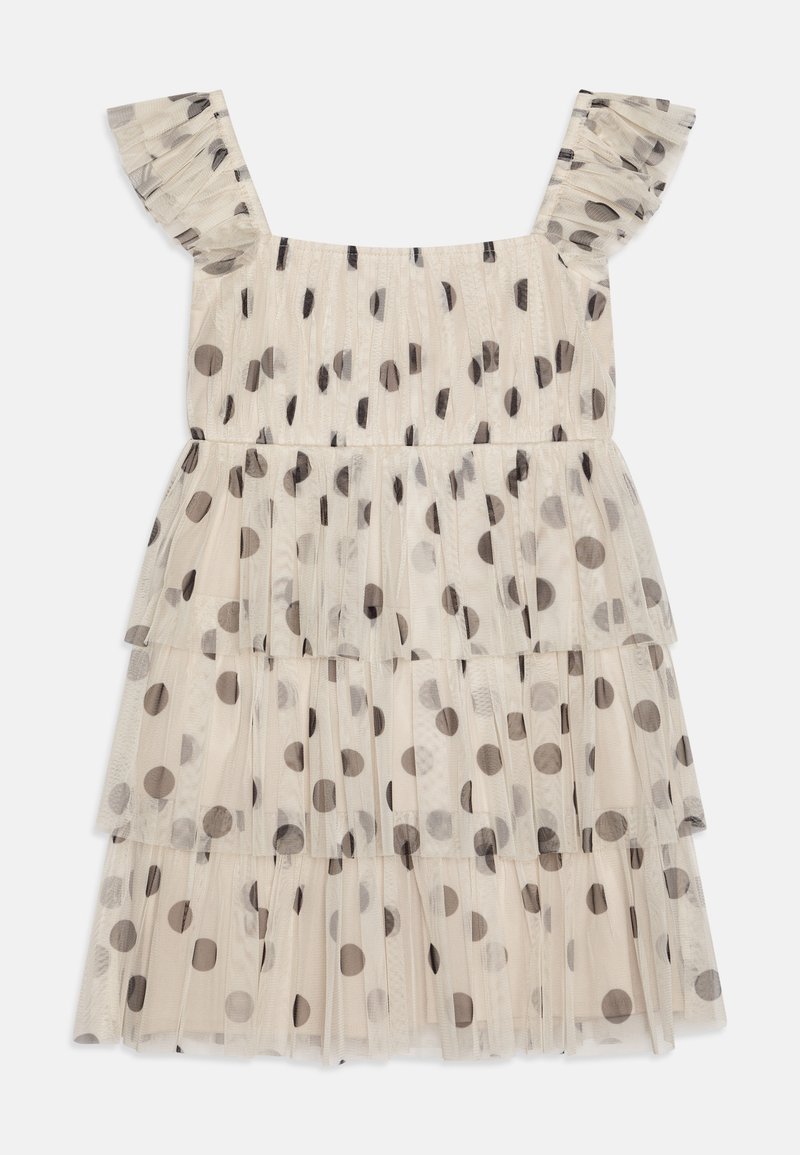 Φόρεμα νήπιο από κρεμ τούλι με μαύρες βούλες, με βολάν τιράντες και επίπεδη σχεδίαση. Ελαφρύ και διαφανές υλικό.