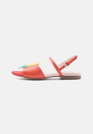Red flat sandal with open toe, ankle strap, and decorative yellow and green flower detail on front strap.