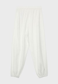 Pantalon blanc ample avec taille et poignets élastiques, conçu pour le confort et une tenue décontractée.