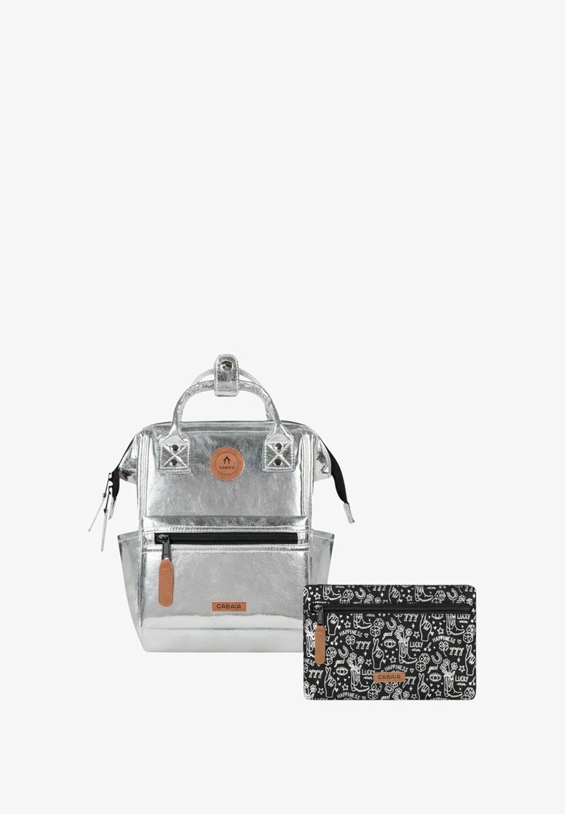 Silver backpack with textured metallic finish, adjustable straps, front zip pocket, and a small black pouch featuring white doodle patterns.