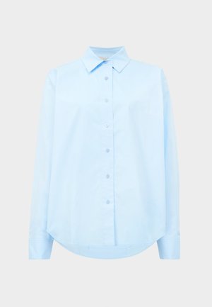 Light blue long-sleeve shirt made of cotton, featuring a pointed collar, button front, and curved hem. Smooth texture with subtle sheen.