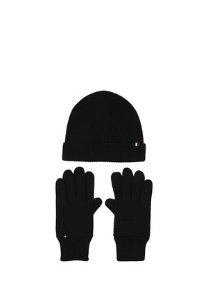 Black knit winter hat and matching gloves displayed on a white background with small rectangular tags on each item.
