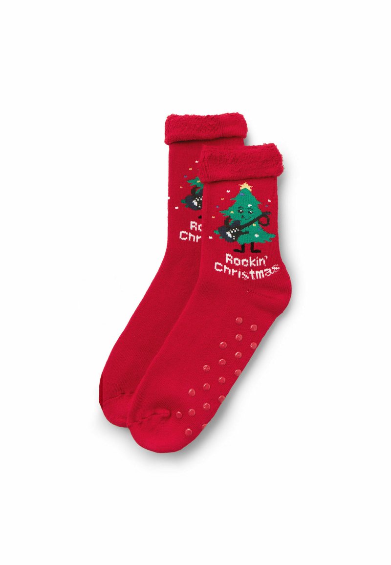 Red cotton socks featuring a green Christmas tree graphic playing guitar, with "Rockin' Christmas" text and textured non-slip dots on the soles.