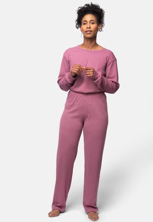 Gestreiftes, langärmliges Oberteil und Hose aus weichem, pinkfarbenem Stoff. Bequemer Schnitt mit elastischem Bund und weitem Bein, geeignet für Loungewear.
