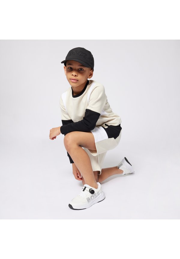 BERMUDA - Tracksuit bottoms - sand