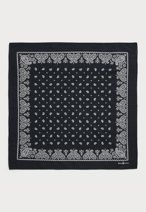 Bandana bleu marine avec des motifs paisley et des pois blancs, bordé de détails blancs complexes. Tissu doux en forme carrée.