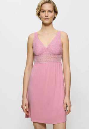 Pink nightdress with a v-neck, featuring a textured lace bodice and smooth skirt. The straps are wide and the fabric has a soft texture.