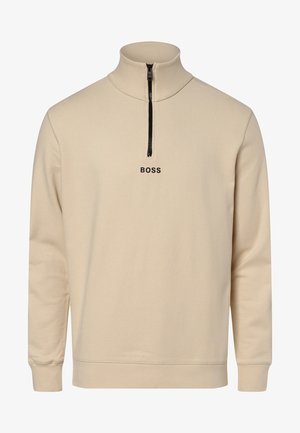 Beiger Sweatshirt mit Reißverschluss und hohem Kragen, schwarzem Reißverschluss und "BOSS"-Logo in schwarzer Schrift auf der Vorderseite. Weiche, glatte Textur.