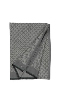 Coperta grigia a motivo con un design a diamante, caratterizzata da una finitura testurizzata e bordi frangiati, con sottili accenti verdi.
