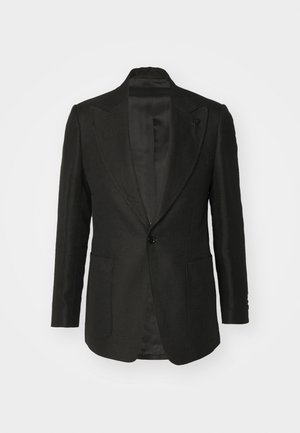 Blazer noir en tissu texturé, fermeture à un bouton, revers crantés et deux poches frontales. Intérieur doublé, coupe ajustée.