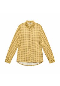 Camicia a maniche lunghe in tessuto leggero, con sfondo giallo e motivi circolari rossi e neri distribuiti uniformemente, orlo arrotondato.