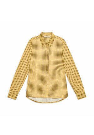Long-sleeve shirt made of lightweight fabric, featuring a yellow background with evenly spaced red and black circular patterns, rounded hem.