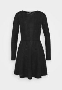 Svart långärmad klänning i ribbat tyg, med rund halsringning och en utsvängd kjol som slutar ovanför knäna.