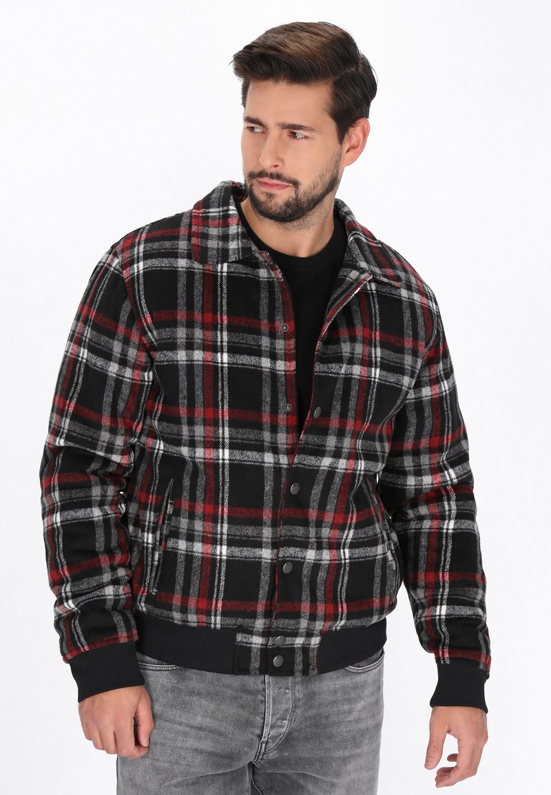 Schwarze, rote und graue karierte Jacke aus strukturiertem Stoff; mit Kragen, Knopfverschluss sowie gerippten Bündchen und Saum.}}