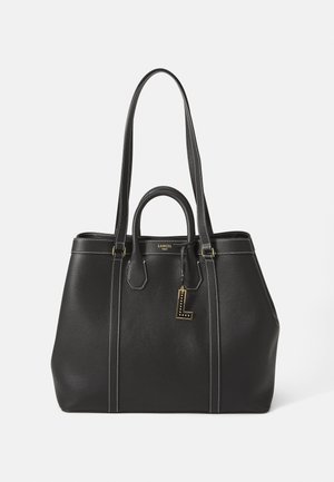 Black leather tote bag with dual handles, gold hardware, and white stitching; includes a decorative letter tag and structured shape.