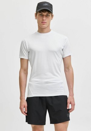 White athletic t-shirt with short sleeves, smooth texture, and a logo at the chest, paired with black shorts featuring a small logo.