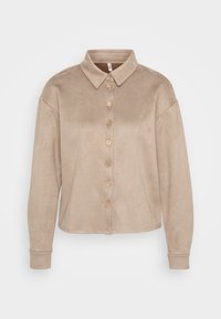Beige button-up shirt made of soft suede-like material. Features a collar, long sleeves, and wooden buttons down the front.