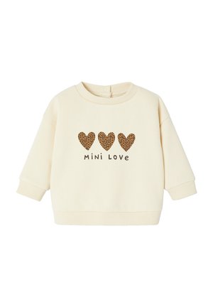 Cremefarbener Pullover mit drei Leopardenmuster-Herzen und dem Text "Mini Love". Mit weitem Ärmel und gerippten Bündchen. Weicher Stoff.