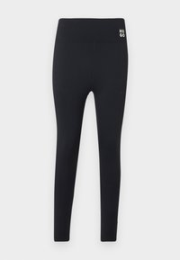 Svarta leggings i stretchmaterial med bred midja, smal passform och en liten vit logotyp på vänster höft. Slät textur.