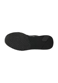 Schwarze Sneakersohle mit strukturiertem Griffmuster, das sowohl kreisförmige als auch gezackte Profile aufweist und eine glatte, erhöhte Akzentuierung nahe der Ferse besitzt.