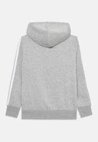 Gray hooded sweatshirt with white side stripes, ribbed cuffs, and hem. Made from soft fabric with a smooth texture. Simple, casual design.