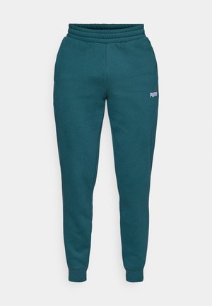 Pantaloni della tuta teal con cintura e polsini elastici, con un piccolo logo sulla coscia sinistra. Realizzati in morbido tessuto testurizzato.