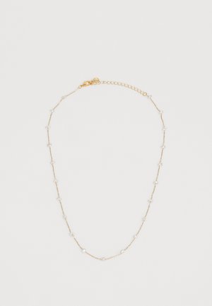 Gold chain necklace with small white bead accents, featuring a delicate design and adjustable length with a lobster clasp closure.