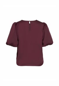 Blusa bordeaux con maniche a palloncino corte, texture liscia, scollatura rotonda e apertura a chiave sul retro chiusa con un piccolo bottone.