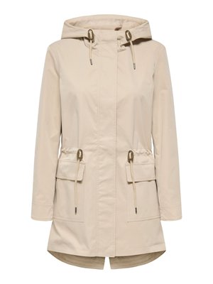 Beige hooded rain jacket with long sleeves, adjustable drawstrings at hood and waist, two large front flap pockets, and a slight fishtail hem.