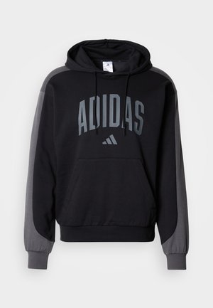 Sudadera con capucha en negro con detalles en gris. Cuenta con un bolsillo canguro, puños acanalados y el logotipo audaz "ADIDAS" en el frontal. Material suave.