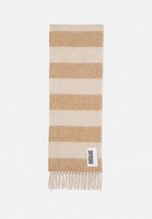 Écharpe à rayures horizontales alternées beige et crème, avec des extrémités à franges, et une étiquette blanche avec le texte « DRYKORN » dans un coin.