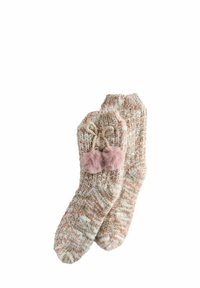 Soft knitted beige and brown marled socks with two pink fluffy pom-poms tied with a bow on one sock.