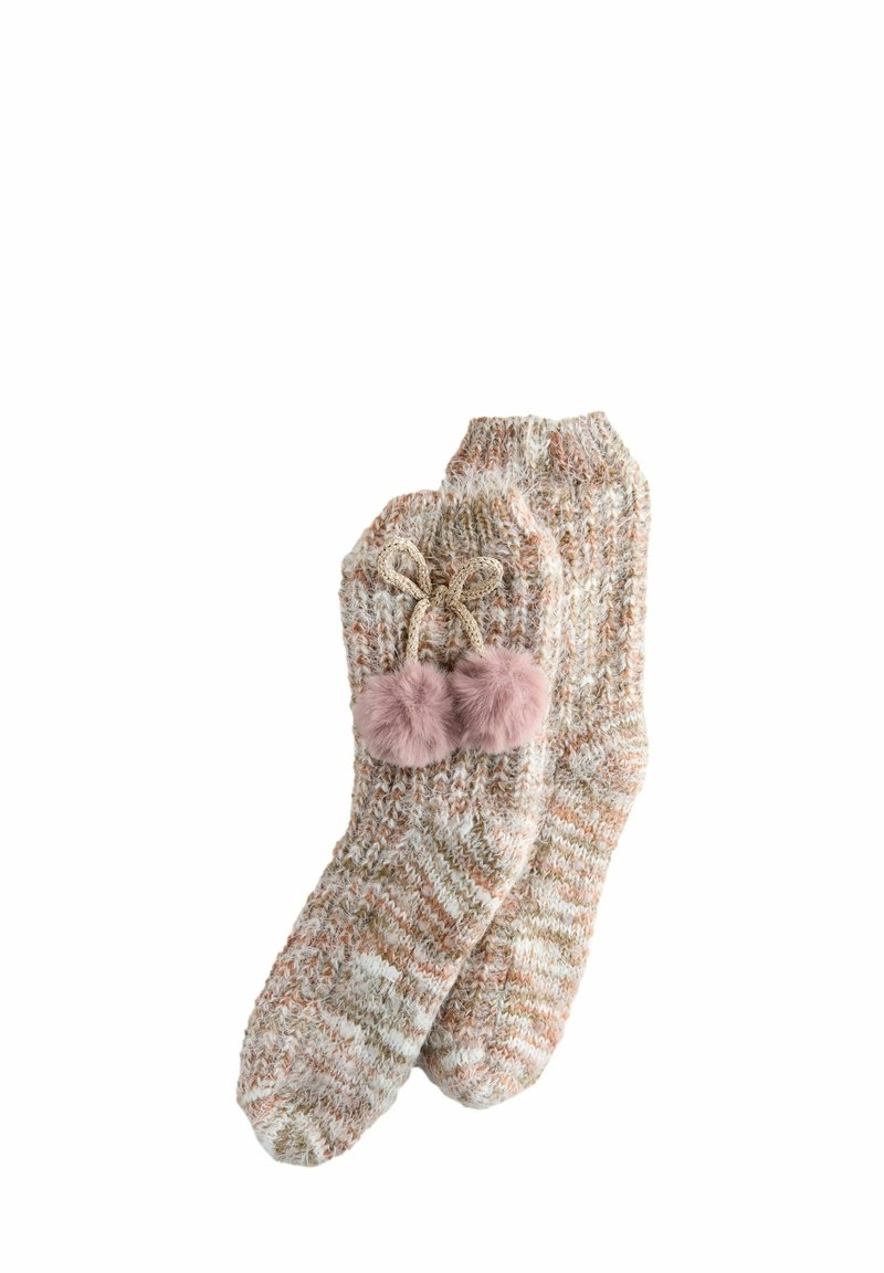 Soft knitted beige and brown marled socks with two pink fluffy pom-poms tied with a bow on one sock.