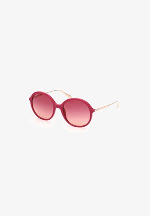 Ochelari de soare rotunzi cu un cadru lucios de culoare fucsia și lentile roz cu degrade. Brațe subțiri din metal auriu. Design simplu și modern.