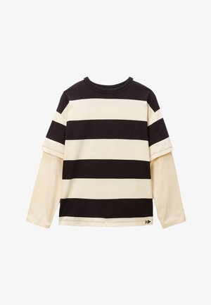 Chemise à manches longues rayée avec de larges rayures horizontales noires et crème, col rond et design de manches superposées. Matière en coton doux.