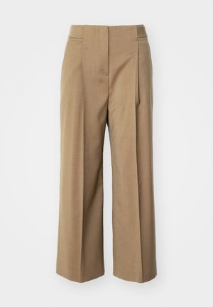Beige skræddersyede vide bukser med frontfolder, glat tekstur og lommer på hver side. Rent design og mellemhøj talje.