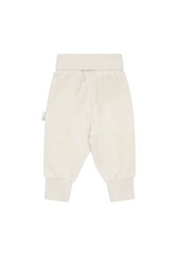 Pantaloni per bambini color crema realizzati in tessuto morbido, con una vita elastica e polsini aderenti alle caviglie.