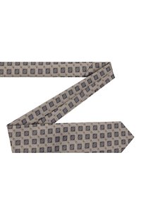 Be�żowy krawat w geometryczny granatowy wzór, wykonany z teksturowanej tkaniny, z zakończeniem w szpic i wąskim kroju.